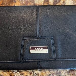 BCBG Paris Classic Black Clutch Purse With Gold Logo Bar